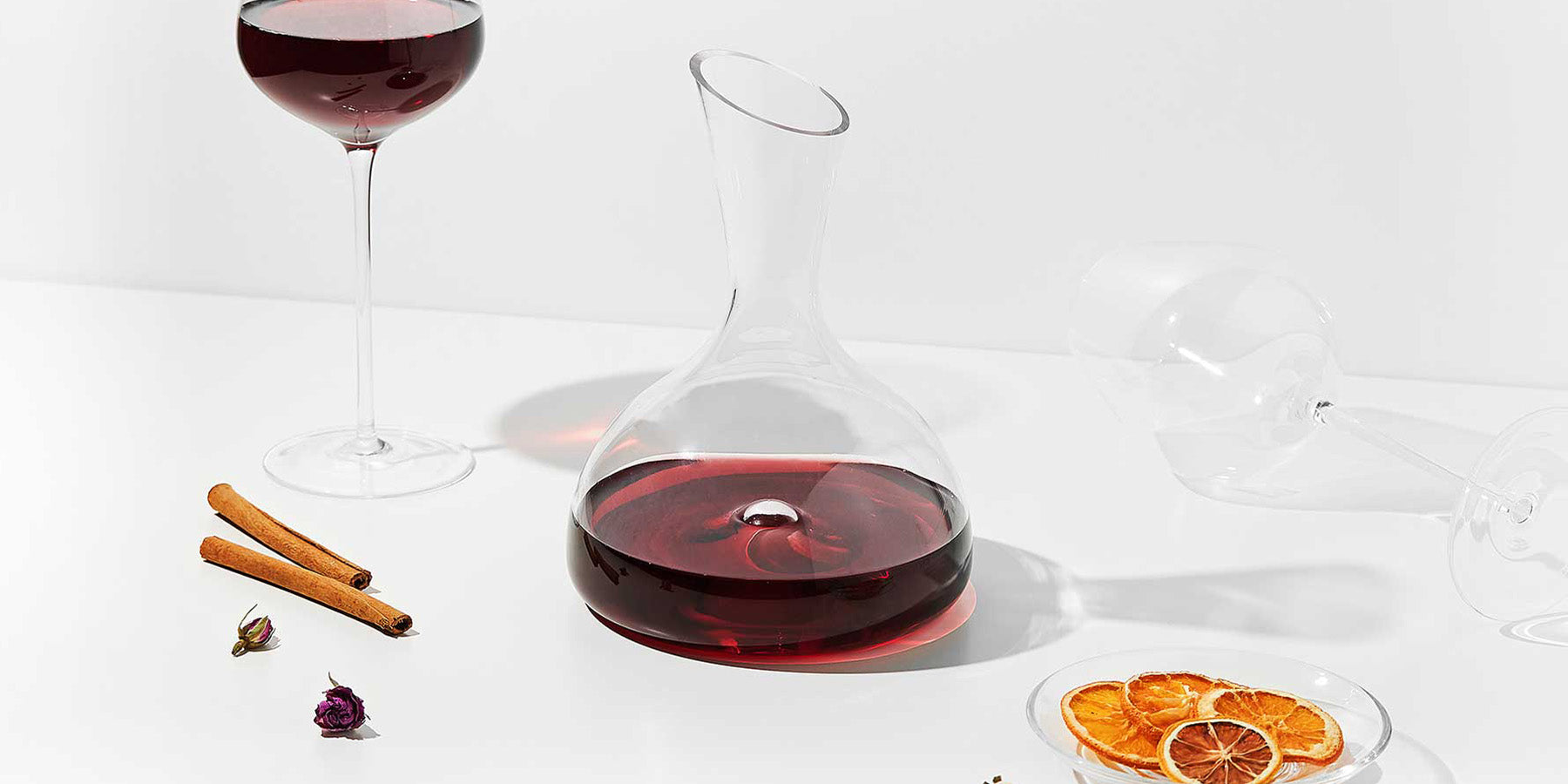 Vintorio GoodGlassware Personal Wine Decanter with orange slices and cinnamon sticks