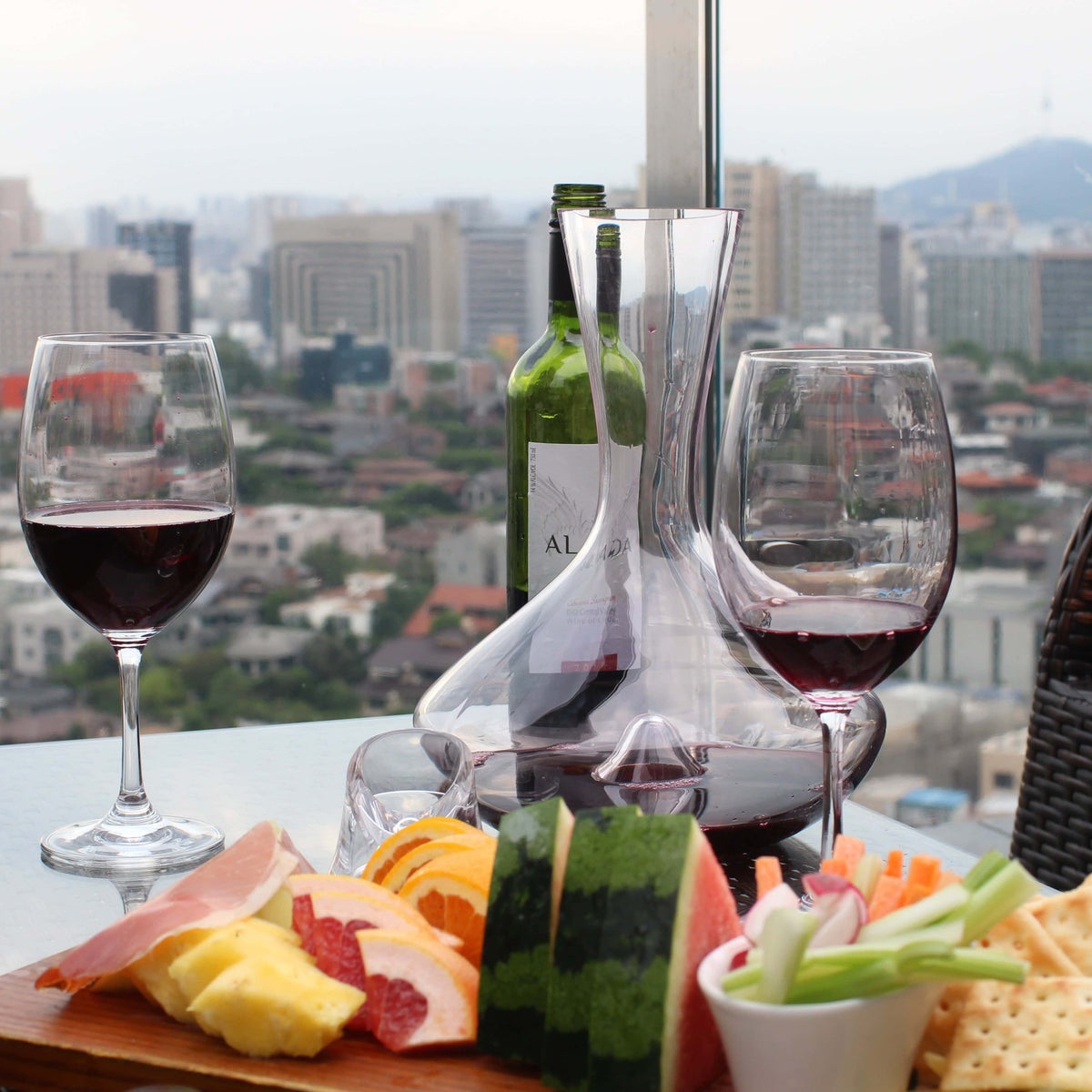 Vintorio Citadel Crystal Wine Decanter with snack plate at a Rooftop Bar